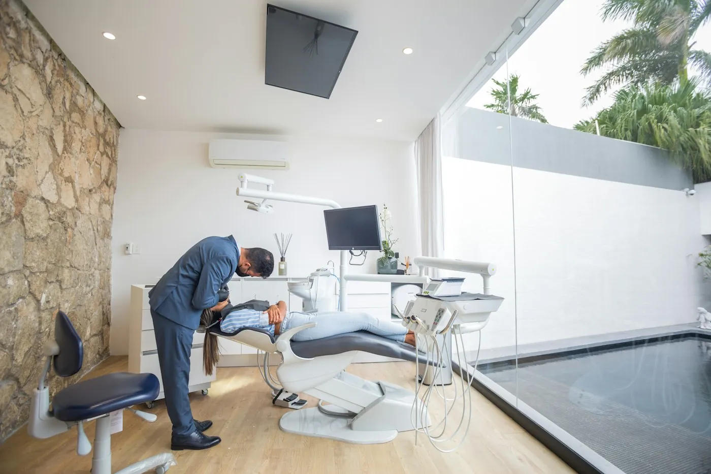 Dentist treating a patient in a modern clinic
